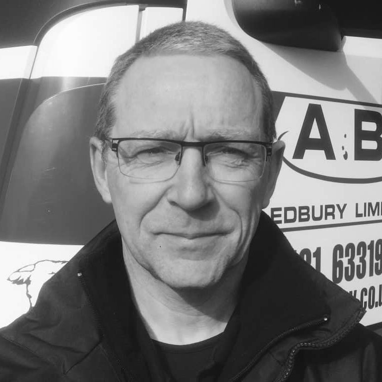 Clive-Brooks-1024x768 two men in building yard with hard hats, shaking hands