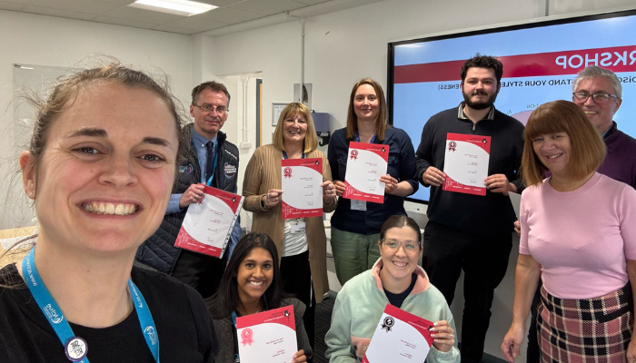 men in hi visibility jackets packing boxes